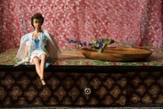 Barbie doll dresses in worn out white fabric with blue stains